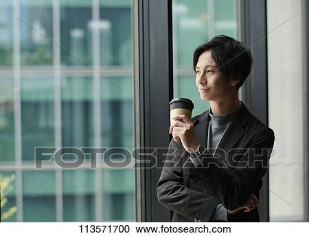 Stock Image - Young Japanese businessman. Fotosearch