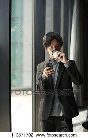 Stock Image - Young Japanese businessman. Fotosearch