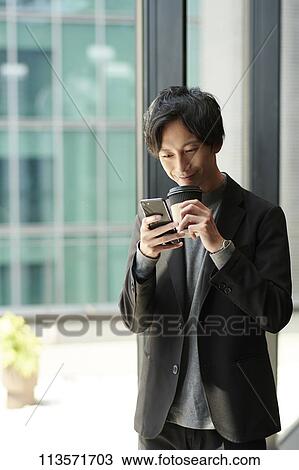 Young Japanese businessman View Large Photo Image Stock Image - Young Japanese businessman. Fotosearch