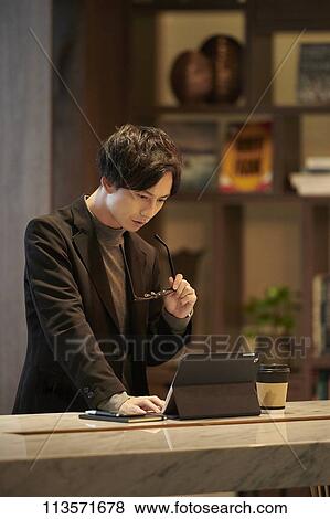 Stock Photo - Young Japanese businessman. Fotosearch
