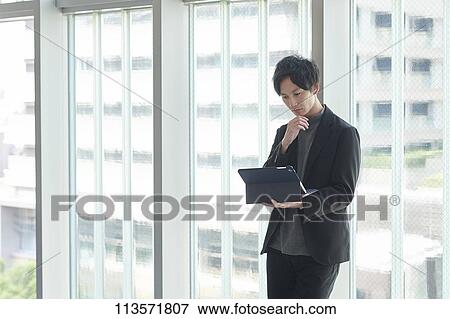 Stock Photo - Young Japanese businessman. Fotosearch
