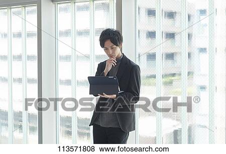 Young Japanese businessman View Large Photo Image Stock Photo - Young Japanese businessman. Fotosearch
