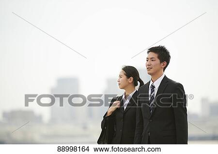 Picture - Young Japanese businesspeople. Fotosearch