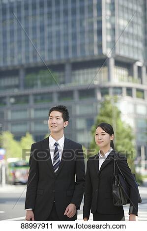 Stock Image - Young Japanese businesspeople. Fotosearch