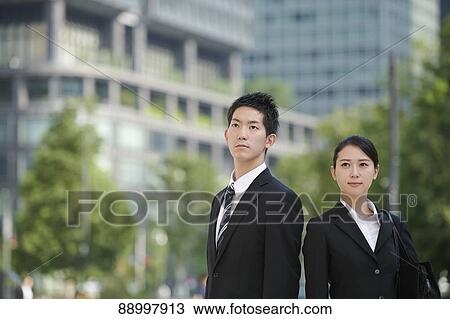 Stock Image - Young Japanese businesspeople. Fotosearch