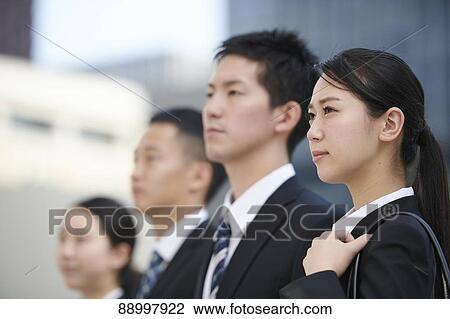Stock Image - Young Japanese businesspeople. Fotosearch