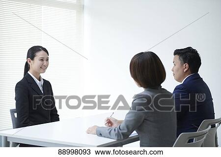 Stock Image - Young Japanese businesspeople. Fotosearch