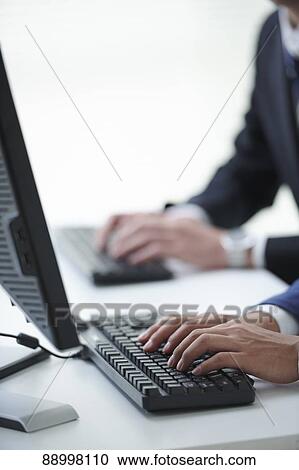 Stock Image - Young Japanese businesspeople. Fotosearch