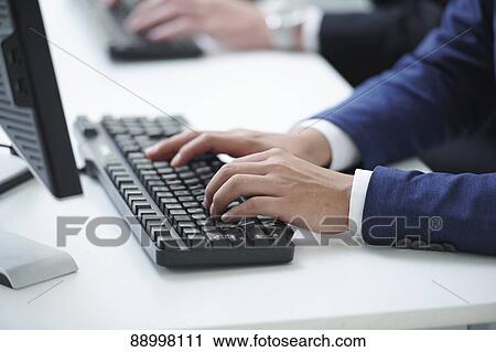 Stock Image - Young Japanese businesspeople. Fotosearch