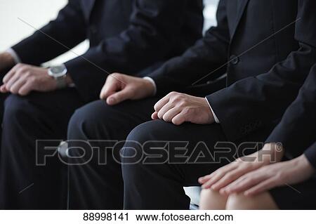 Stock Image - Young Japanese businesspeople. Fotosearch