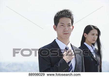 Stock Photo - Young Japanese businesspeople. Fotosearch