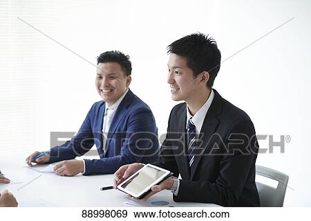 Stock Photo - Young Japanese businesspeople. Fotosearch