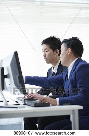 Stock Photo - Young Japanese businesspeople. Fotosearch