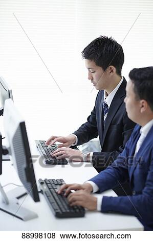 Stock Photo - Young Japanese businesspeople. Fotosearch