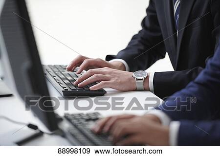 Stock Photo - Young Japanese businesspeople. Fotosearch