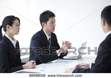 Stock Photograph - Young Japanese businesspeople. Fotosearch