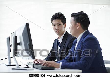 Stock Photograph - Young Japanese businesspeople. Fotosearch