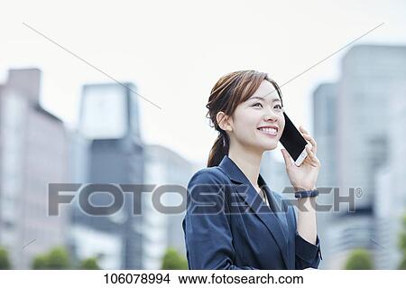 Young Japanese businesswoman downtown View Large Photo Image Picture - Young Japanese businesswoman downtown. Fotosearch