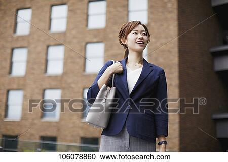 Young Japanese businesswoman downtown View Large Photo Image Stock Image - Young Japanese businesswoman downtown. Fotosearch