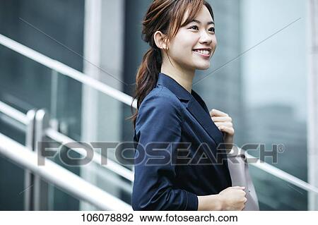 Young Japanese businesswoman downtown View Large Photo Image Stock Image - Young Japanese businesswoman downtown. Fotosearch