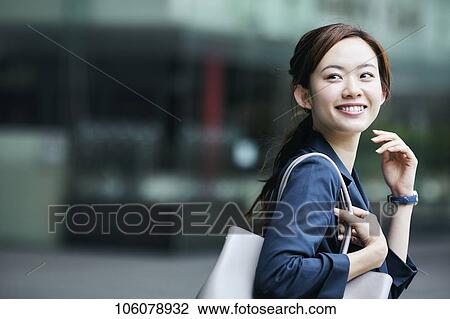 Young Japanese businesswoman downtown View Large Photo Image Stock Image - Young Japanese businesswoman downtown. Fotosearch