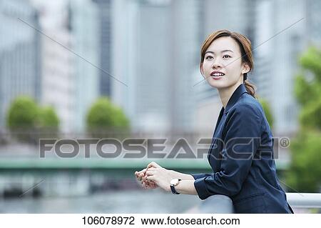 Young Japanese businesswoman downtown View Large Photo Image Stock Image - Young Japanese businesswoman downtown. Fotosearch