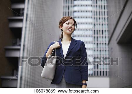 Young Japanese businesswoman downtown View Large Photo Image Stock Photo - Young Japanese businesswoman downtown. Fotosearch