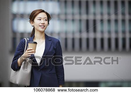 Stock Photo - Young Japanese businesswoman downtown. Fotosearch
