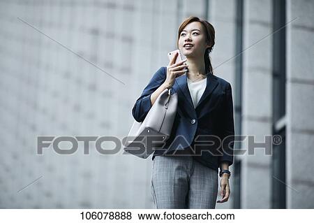 Young Japanese businesswoman downtown View Large Photo Image Stock Photo - Young Japanese businesswoman downtown. Fotosearch