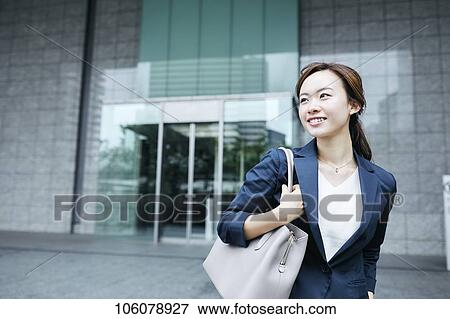 Young Japanese businesswoman downtown View Large Photo Image Stock Photo - Young Japanese businesswoman downtown. Fotosearch