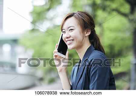 Young Japanese businesswoman downtown View Large Photo Image Stock Photo - Young Japanese businesswoman downtown. Fotosearch