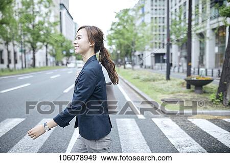 Young Japanese businesswoman downtown View Large Photo Image Stock Photo - Young Japanese businesswoman downtown. Fotosearch