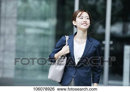 Stock Photograph - Young Japanese businesswoman downtown. Fotosearch
