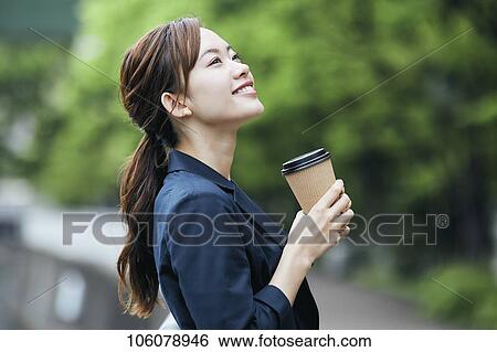 Young Japanese businesswoman downtown View Large Photo Image Stock Photograph - Young Japanese businesswoman downtown. Fotosearch