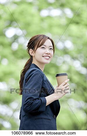 Young Japanese businesswoman downtown View Large Photo Image Stock Photograph - Young Japanese businesswoman downtown. Fotosearch