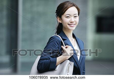 Young Japanese businesswoman downtown View Large Photo Image Stock Photography - Young Japanese businesswoman downtown. Fotosearch