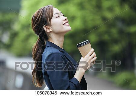 Young Japanese businesswoman downtown View Large Photo Image Stock Photography - Young Japanese businesswoman downtown. Fotosearch