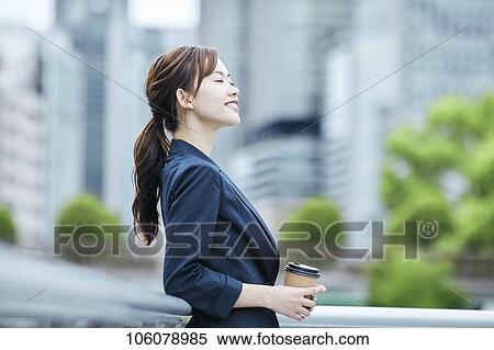 Young Japanese businesswoman downtown View Large Photo Image Stock Photography - Young Japanese businesswoman downtown. Fotosearch