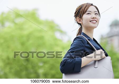 Young Japanese businesswoman downtown View Large Photo Image Stock Photography - Young Japanese businesswoman downtown. Fotosearch