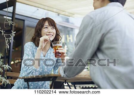 Picture - Young Japanese couple on a date. Fotosearch