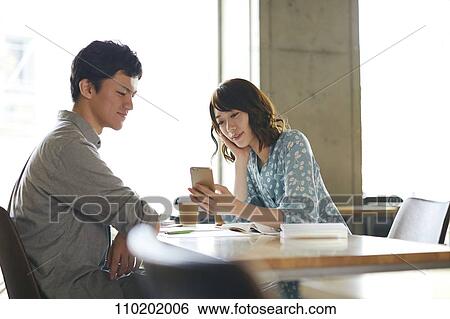 Young Japanese couple on a date View Large Photo Image Stock Photograph - Young Japanese couple on a date. Fotosearch