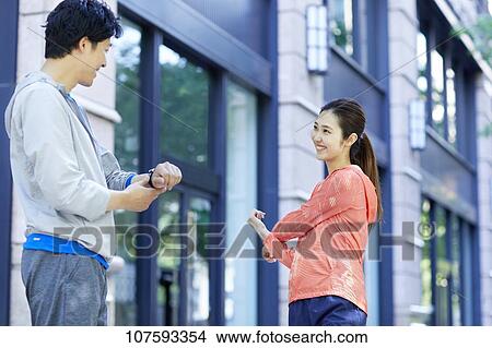 Young Japanese couple running downtown Tokyo View Large Photo Image Picture - Young Japanese couple running downtown Tokyo. Fotosearch