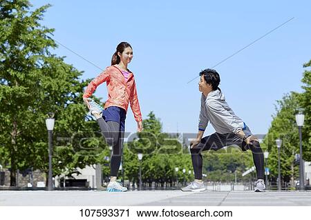 Young Japanese couple running downtown Tokyo View Large Photo Image Stock Image - Young Japanese couple running downtown Tokyo. Fotosearch