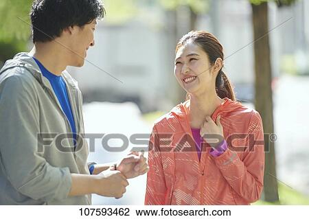 Young Japanese couple running downtown Tokyo View Large Photo Image Stock Image - Young Japanese couple running downtown Tokyo. Fotosearch