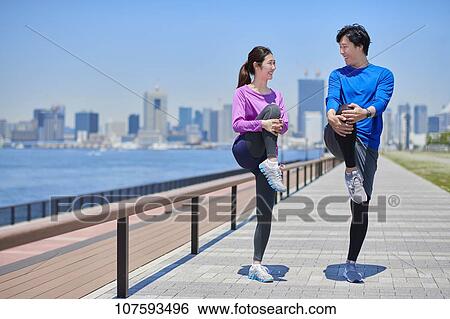 Young Japanese couple running downtown Tokyo View Large Photo Image Stock Photograph - Young Japanese couple running downtown Tokyo. Fotosearch