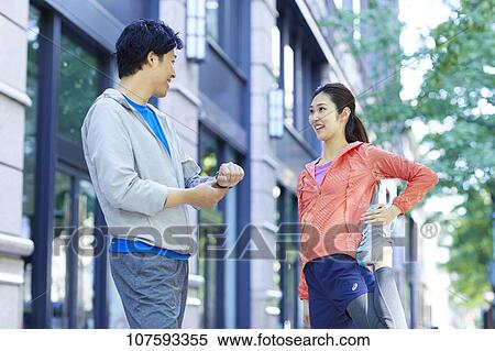 Young Japanese couple running downtown Tokyo View Large Photo Image Stock Photography - Young Japanese couple running downtown Tokyo. Fotosearch
