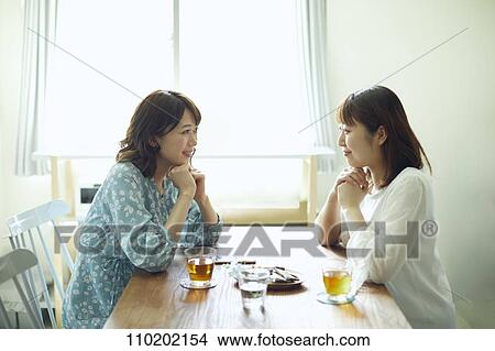 Picture - Young Japanese friends having fun together. Fotosearch