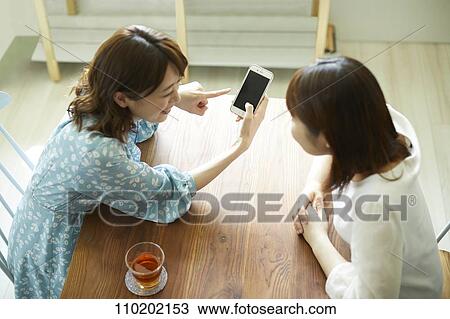Young Japanese friends having fun together View Large Photo Image Stock Image - Young Japanese friends having fun together. Fotosearch