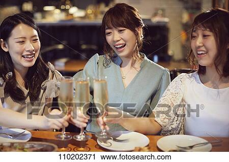 Young Japanese friends having fun together View Large Photo Image Stock Image - Young Japanese friends having fun together. Fotosearch