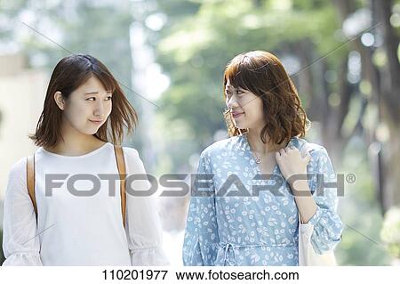 Young Japanese friends having fun together View Large Photo Image Stock Photo - Young Japanese friends having fun together. Fotosearch